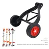 A black and red garden tool accessory with wheels, shown against a white background. A smaller inset image shows several garden tools. Náhled obrázku produktu