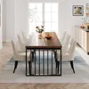A dining room with a wooden table and chairs, set up for a meal. Produktbild-Vorschau
