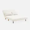 A cream-colored sofa bed with two pillows, shown from a side-front angle against a white background. Produktbild-Vorschau