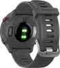 The back of a gray Garmin Forerunner 55 smartwatch is shown, with the heart rate sensor illuminated in green. Náhľad obrázku produktu
