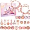 A collection of rose gold and pink charm bracelets and charms, along with a decorative box featuring a pink castle illustration. Produktbild-Vorschau