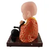 A solar-powered wackelfigur of a Buddha monk. Produktbild-Vorschau