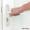 A hand is shown gripping a white door handle with a gold lock cylinder. Produktbild-Vorschau