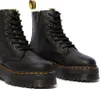A pair of black Dr. Martens boots with a platform sole and fur lining. Anteprima dell’immagine prodotto