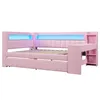 A pink upholstered daybed with integrated LED lighting and a small desk/storage unit on the right side. Produktbild-Vorschau