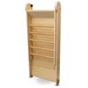 A wooden children's slide with a ladder, folded and standing upright against a white background. Podgląd zdjęcia produktu