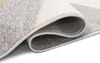 A close-up view of a rolled-up rug, showing the texture and edges. Náhľad obrázku produktu