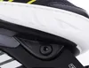 A close-up view of the side of an inline skate, focusing on the connection between the boot and the frame. Produktbild-Vorschau