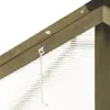 A close-up view of the corner of a greenhouse, showing the wooden frame and a metal hook. Produktbild-Vorschau