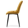 A side view of a mustard yellow upholstered dining chair with black legs. Náhled obrázku produktu