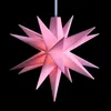 A pink star-shaped lamp against a black background. Produktbild-Vorschau