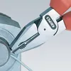 A close-up shot of pliers gripping a wire. Voir les images du produit