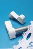 Two white curtain rod holders are shown on a blue background, with a piece of white lace in the foreground. Produktbild-Vorschau