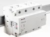 A white electrical relay device mounted on a metal rail. Produktbild-Vorschau
