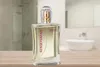 A perfume bottle is displayed on a wooden surface in a bathroom setting. Produktbild-Vorschau
