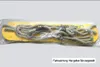 A yellow swing seat with ropes, packaged in plastic. Produktbild-Vorschau