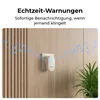 A white doorbell chime plugged into a wall socket, with musical notes emanating from it. Produktbild-Vorschau