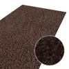 A close-up view of a dark brown shaggy rug, with a magnified circular inset showing more detail of the texture. Anteprima dell’immagine prodotto