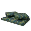 A set of two cushions with a tropical leaf pattern, arranged on a white background. Náhled obrázku produktu