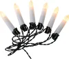 A string of white candle-shaped LED lights on a black wire. Náhled obrázku produktu