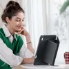 A woman is using a tablet with a case that functions as a stand. Produktbild-Vorschau