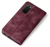 A burgundy flip cover for a smartphone, shown from a diagonal top-down perspective on a white background. Produktbild-Vorschau