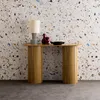 A console table with decorative items against a terrazzo-patterned wall. Anteprima dell’immagine prodotto