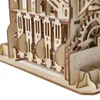 A close-up view of a wooden marble run construction kit, showing intricate gears and wooden pieces. Podgląd zdjęcia produktu