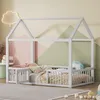 A child's bed with a house-shaped frame, decorated with a cloud-shaped light and geometric wall art. Anteprima dell’immagine prodotto