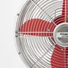 Close-up of a red and chrome fan with the brand logo. Produktbild-Vorschau