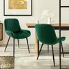 A dining room scene with two green velvet chairs at a wooden table. Náhľad obrázku produktu