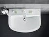 A top-down view of a white bathroom sink with a chrome faucet and accessories. Voir les images du produit