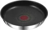 A close-up, top-down view of a black frying pan with a red indicator in the center and a silver rim. Náhľad obrázku produktu