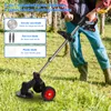 A person is using a wheeled grass trimmer in a grassy outdoor area. Produktbild-Vorschau