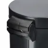 A close-up view of the handle and lid of a black trash can. Podgląd zdjęcia produktu