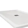 A close-up, angled view of a white shower tray with a silver drain. Podgląd zdjęcia produktu