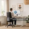 A man is working at a height-adjustable desk in a home office setting. Produktbild-Vorschau