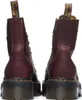 A pair of burgundy Dr. Martens boots shown from the back. Produktbild-Vorschau