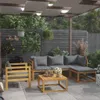 An outdoor patio lounge set with wooden frames and gray cushions, set under a pergola with fabric shades and lights. Náhled obrázku produktu