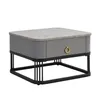 A studio shot of a modern gray side table with a marble-look top and a gold ring drawer pull, set against a white background. Voir les images du produit