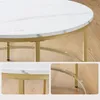 Close-up shots of a round marble-patterned coffee table with a gold metal frame. Náhled obrázku produktu