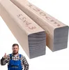A man in work overalls giving a thumbs up next to two wooden beams. Náhľad obrázku produktu