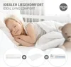 A young girl sleeping peacefully in a white crib with a teddy bear nearby. The image is overlaid with text and graphics illustrating product features and dimensions. Produktbild-Vorschau