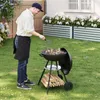 A man is grilling food in a backyard with flowers and a house in the background. Produktbild-Vorschau