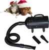 A collage of a dog and cat wearing Santa hats, and a black pet dryer with accessories. Produktbild-Vorschau