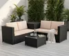 An outdoor patio setting with a rattan sofa set and plants. Anteprima dell’immagine prodotto