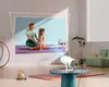 A projector is projecting an image of a woman and a girl doing yoga onto a wall in a living room. The projector is on a small table. Produktbild-Vorschau