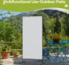 An outdoor patio scene with a white screen divider, blue chairs and table, and potted plants. Náhľad obrázku produktu