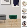 A dark green velvet stool with gold metal legs is shown in a living room setting, next to a grey sofa. The image also includes smaller circular images showcasing the stool in different room settings (living room, bedroom, dining room, office) with German t Produktbild-Vorschau