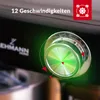 Close-up of a kitchen machine's control dial with a green illuminated center and speed indicators. Produktbild-Vorschau